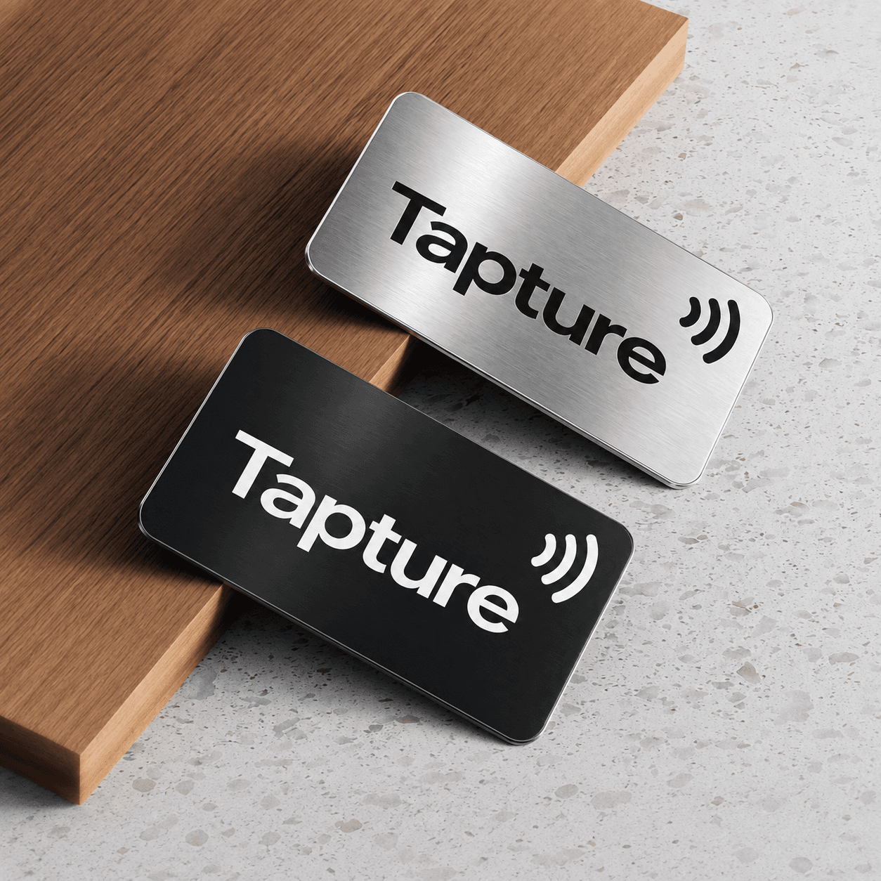 Two Tapture metal cards ready to be set up